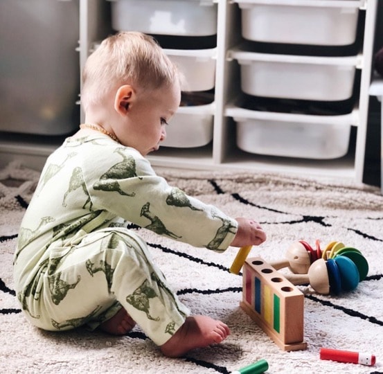 Fletcher is wearing a Kate Quinn Organics onepiece from UpChoose Baby Set